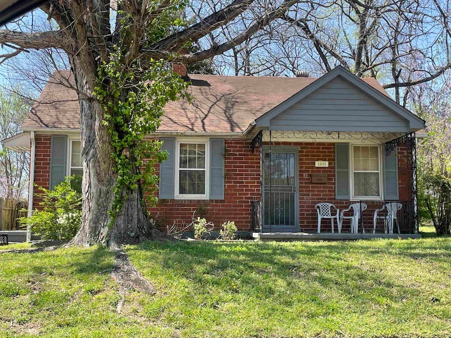 View of front of property featuring roof with shin