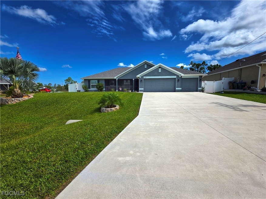 Ranch-style home with a garage, concrete driveway,