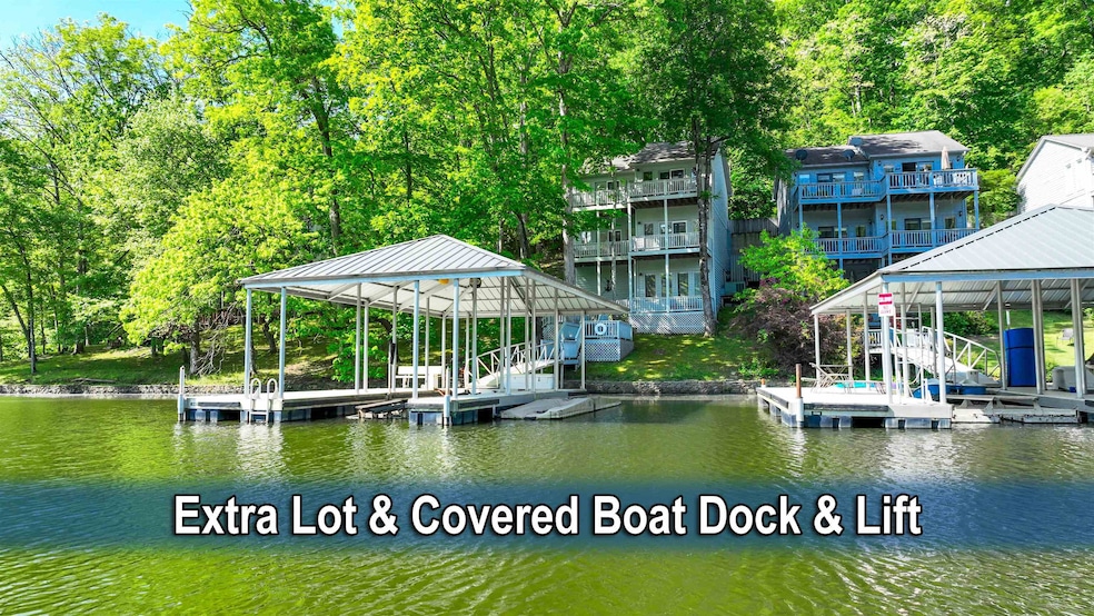 Dock area featuring a water view and boat lift