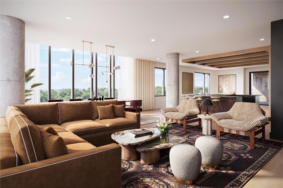Owner’s lounge featuring south-facing views toward Lady Bird Lake, with comfortable seating, bar area, and large windows that fill the space with natural light. A refined social setting designed for relaxation, informal meetings, or private gatherings.