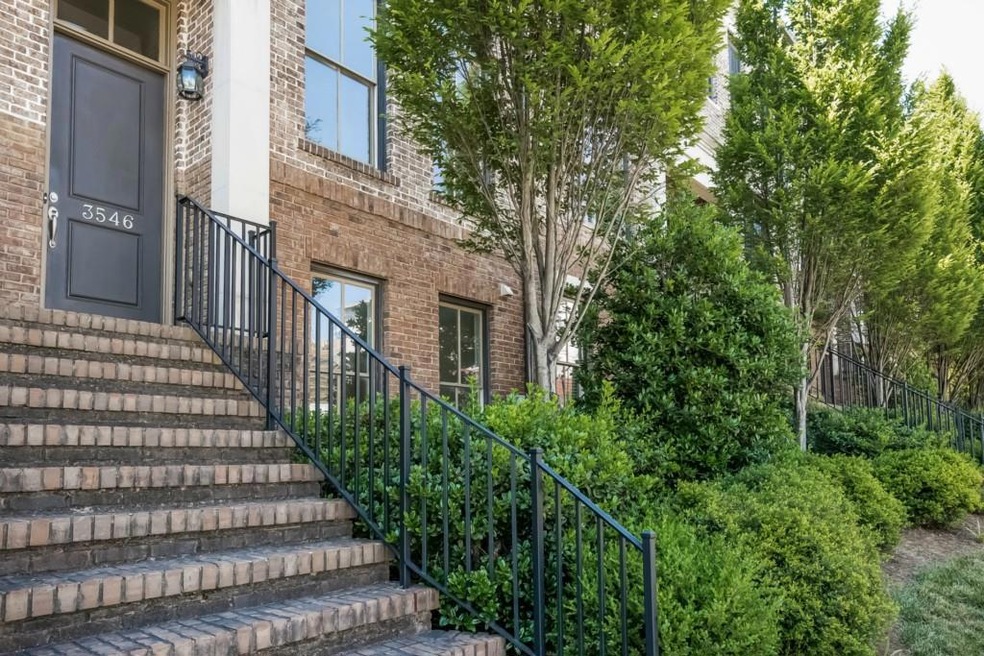 Front entrance is located behind wrought iron fenc