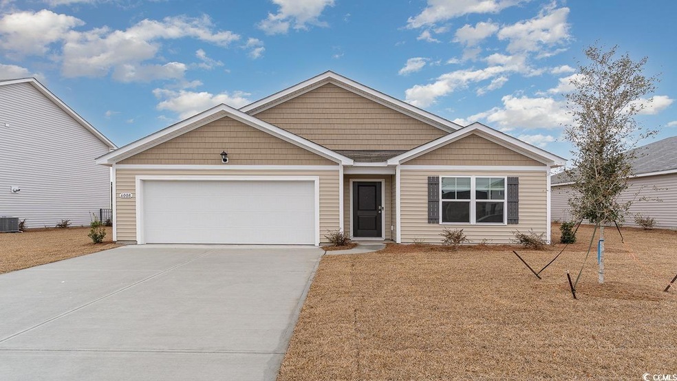 View of front of property with a garage and centra