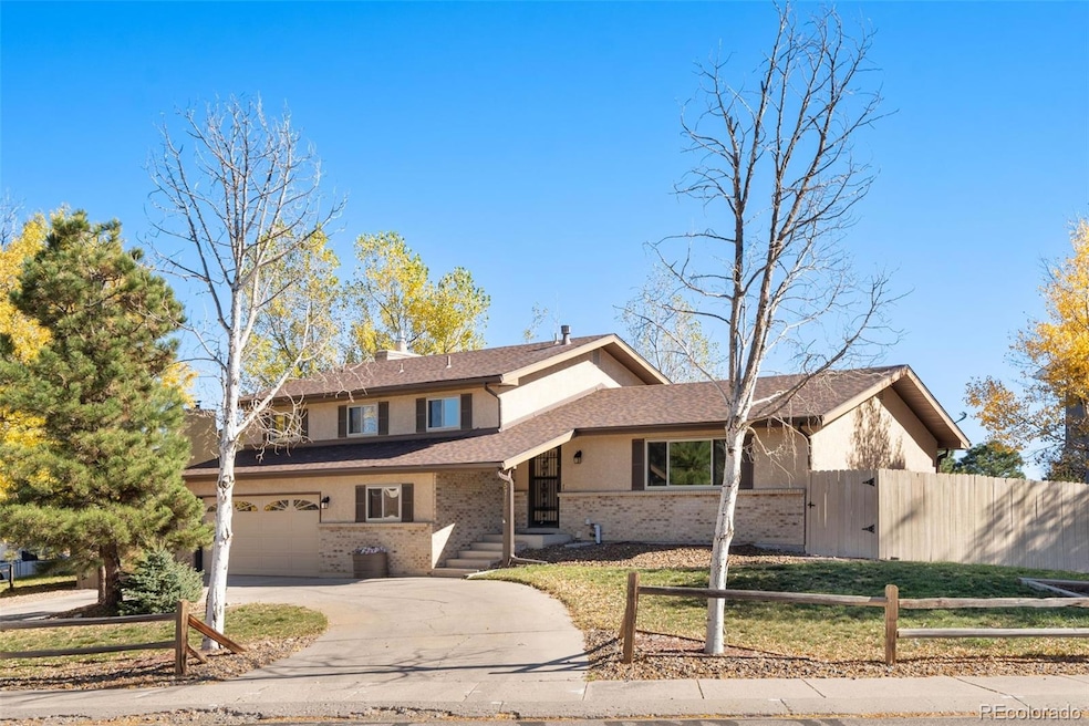 Four level home in Villa Loma with a semi-circular driveway
