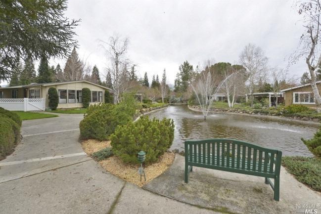 Pond, fountain and landscaping enhance the home's 