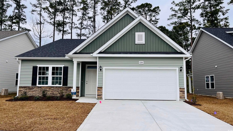 Craftsman-style home featuring a garage