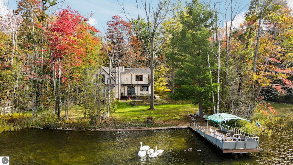 10176 Harmony Dr, Interlochen, MI 49643 - photo 1