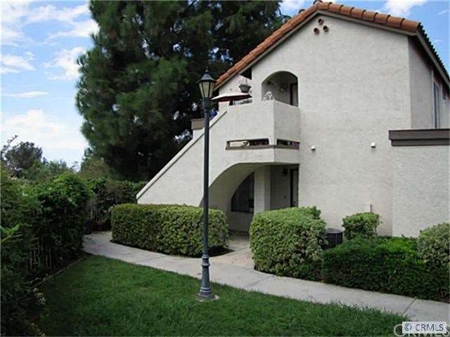 Front walk with secluded greenbelt in front of you