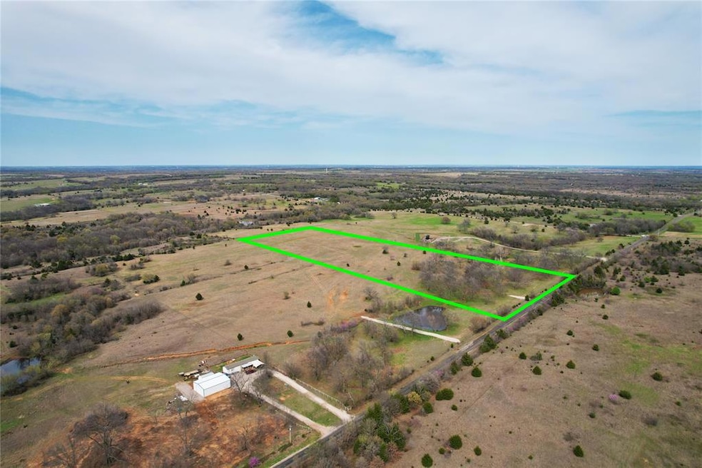 Overview of rural landscape with property boundaries highlighted and a nearby body of water