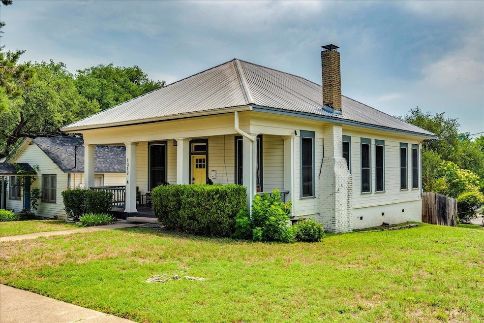 View of front of property featuring a chimney, me