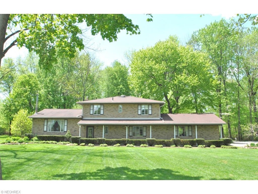 This all brick split level has tons of curb appeal