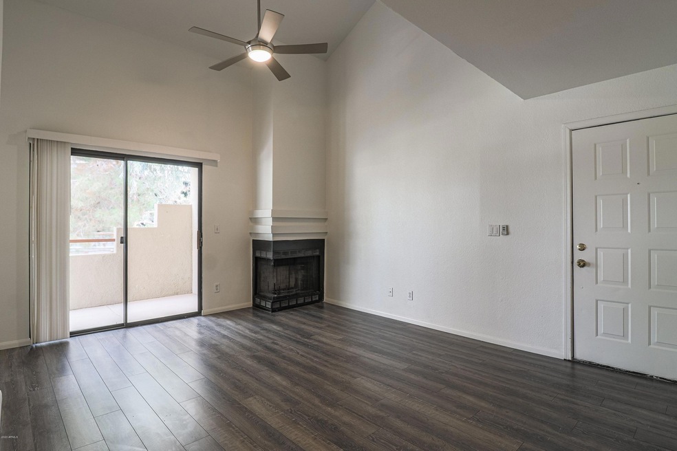 family room with fireplace and balcony