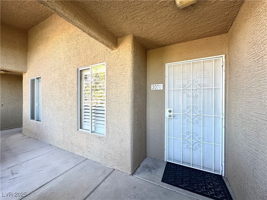 Property entrance with stucco siding