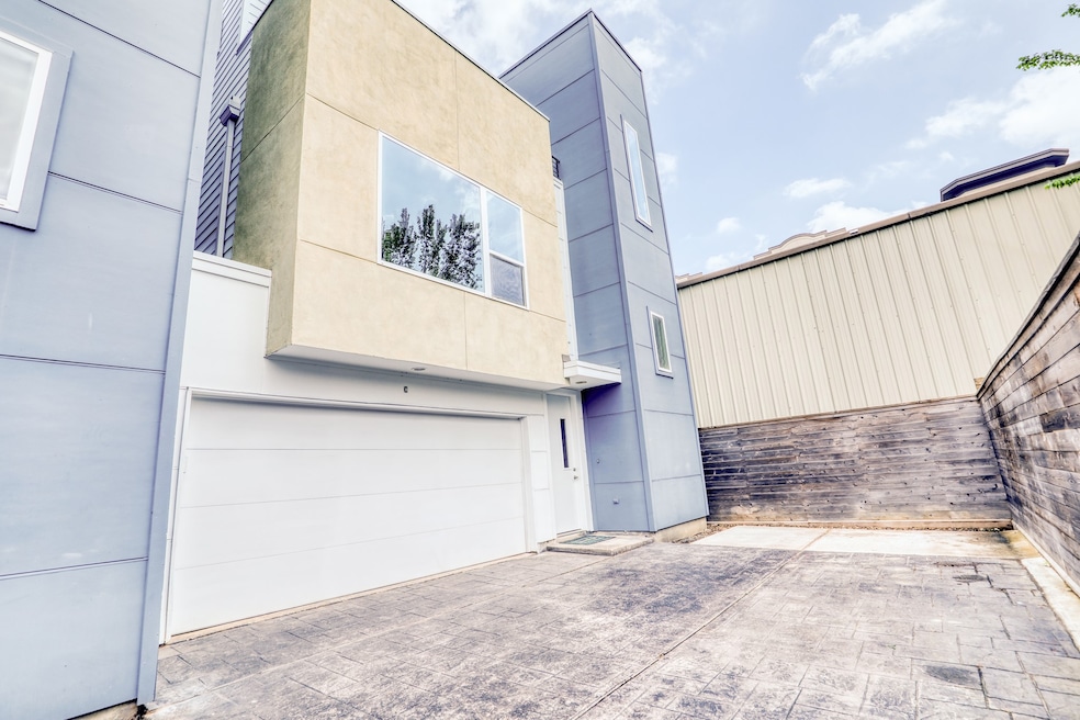 This striking 3-story home in Greater Heights show