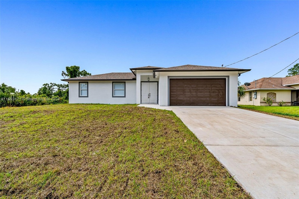 1014 Genoa Ave S, Lehigh Acres, FL 33974 - photo 1