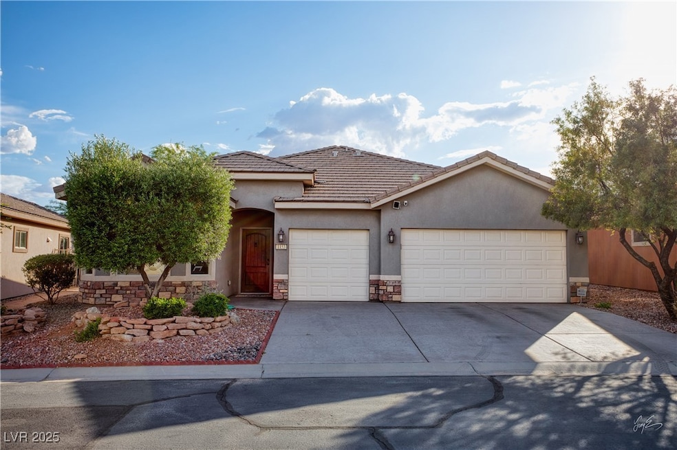 Ranch-style home featuring an attached garage, sto
