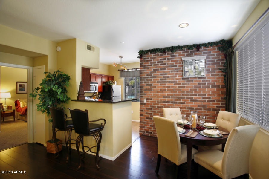 Exposed brick wall and wood flooring!