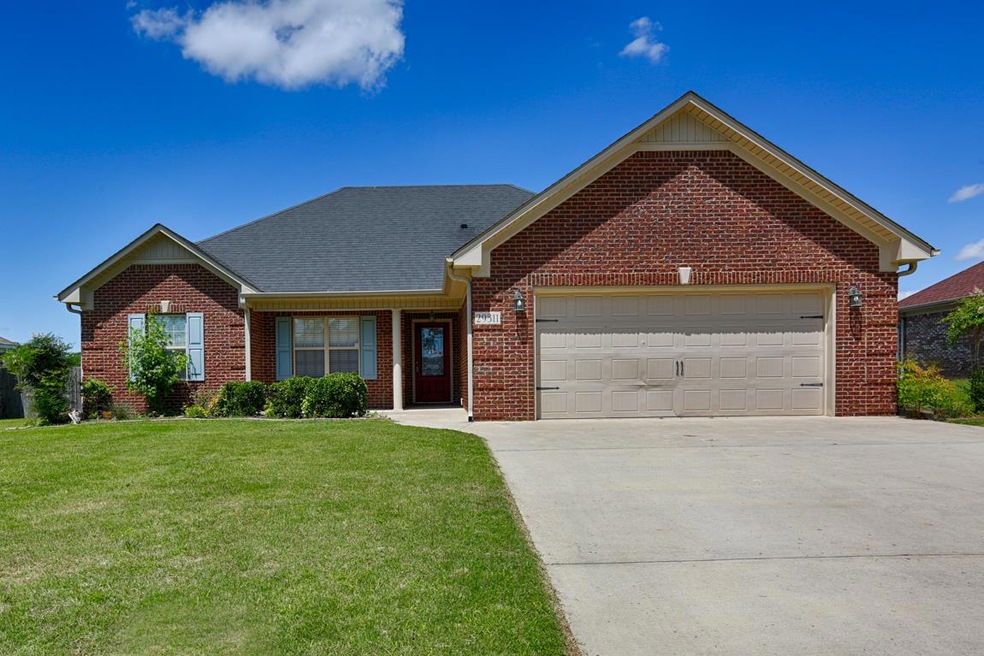 Front View of Home - Full brick home with attached garage, concrete drive, fenced back yard and open & covered back patio.
