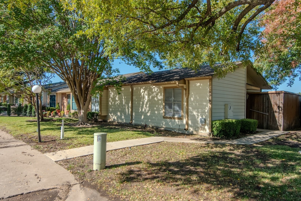 Townhome privacy entrance with a front lawn