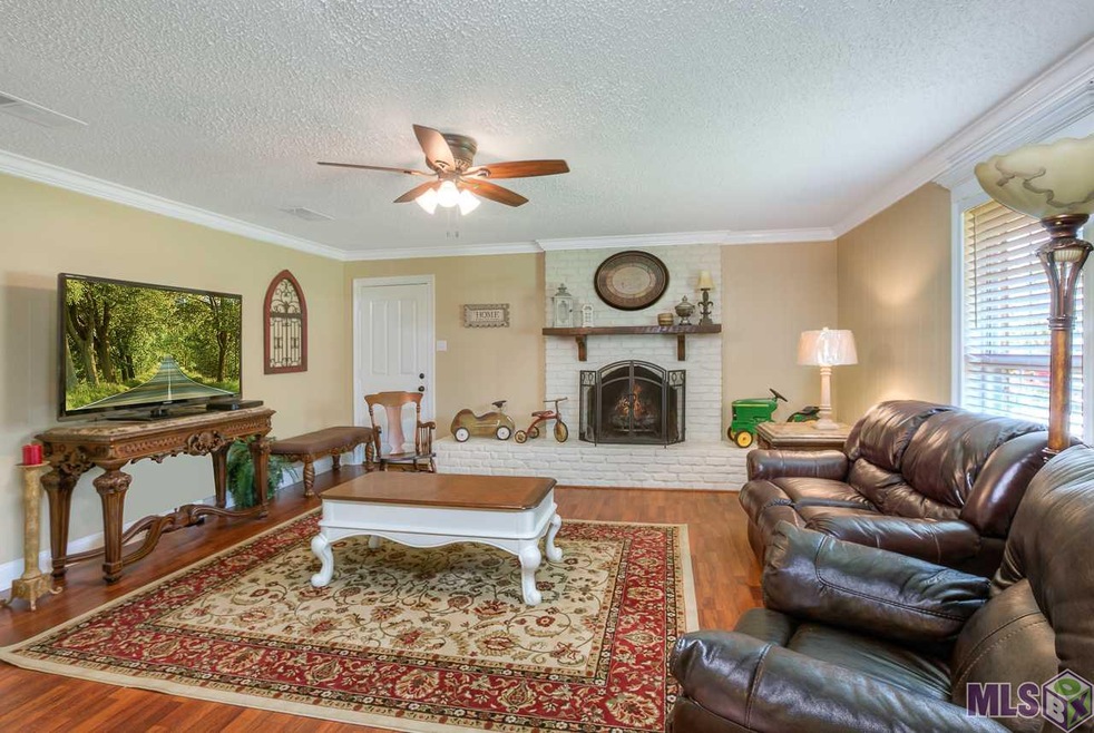 Gorgeous brick fireplace goes almost wall to wall 