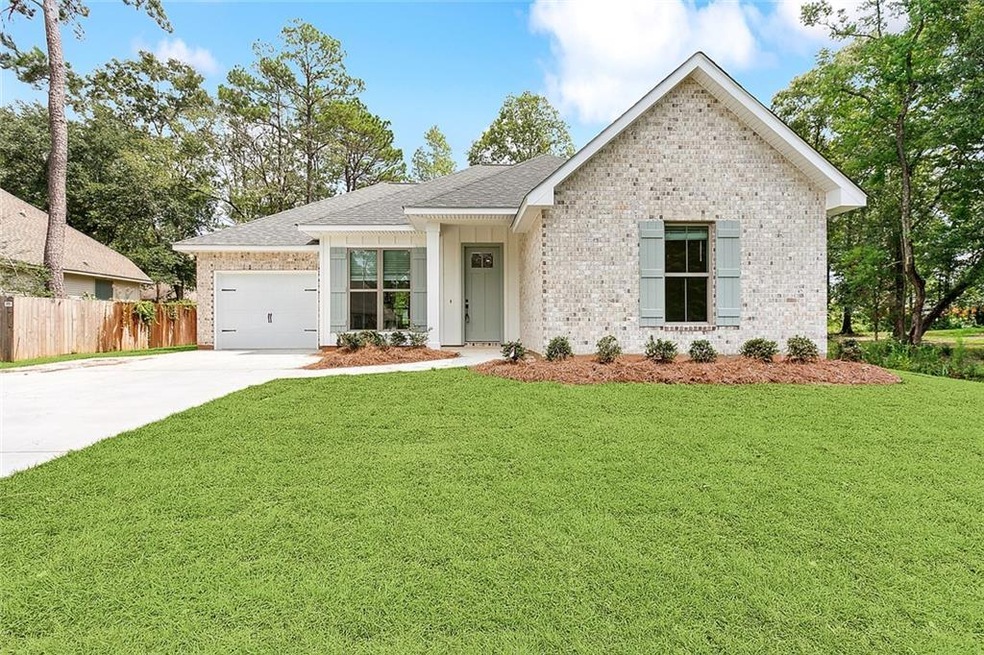 Front Elevation. Fresh landscaping & plenty of cur