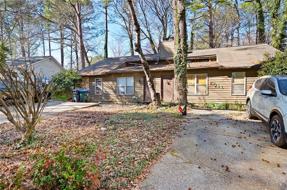 View of front of house with aphalt driveway and a 