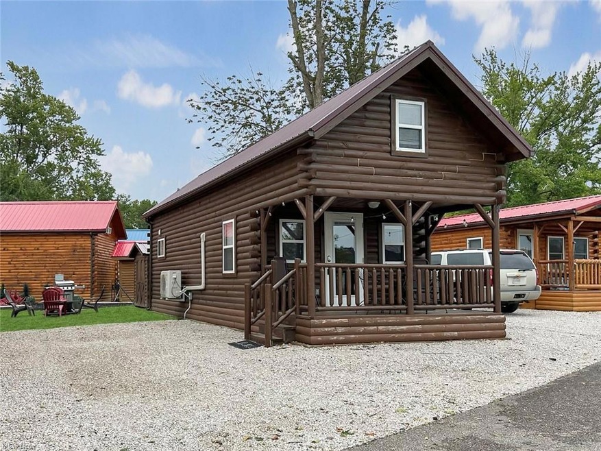 Log cabin with covered front porch