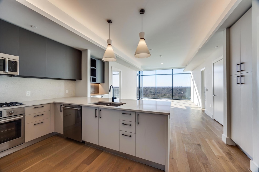 Kitchen with floor to ceiling windows, sink, kitch