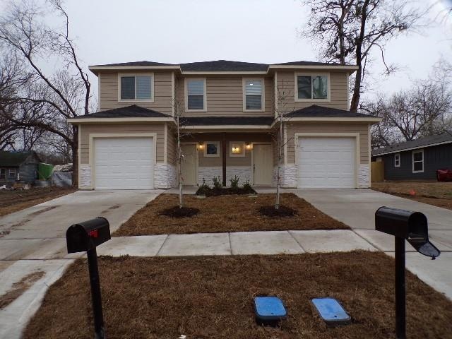 View of front of house featuring concrete driveway