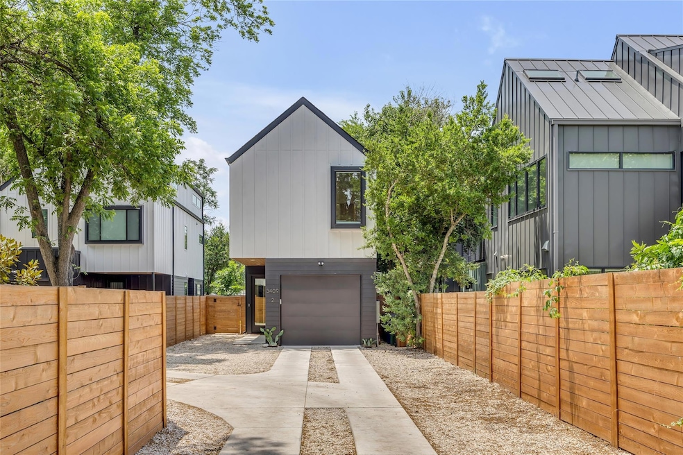 View of front of property featuring concrete driv