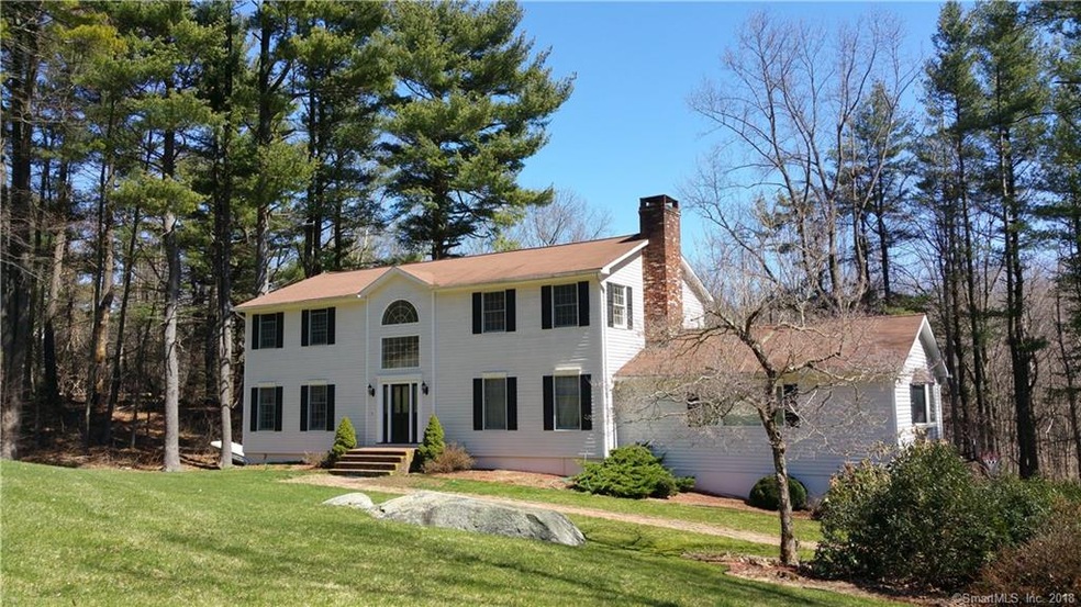 FRONT VIEW. SURROUNDED BY A PINE GROVE. LOTS OF CU