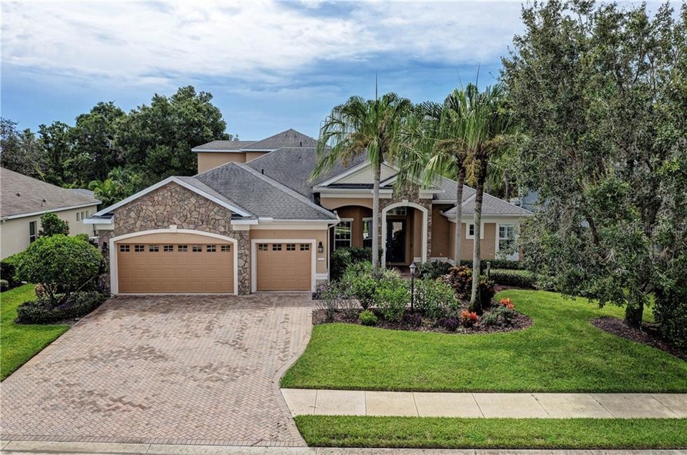 Front of home with Paver drive and sidewalk and st