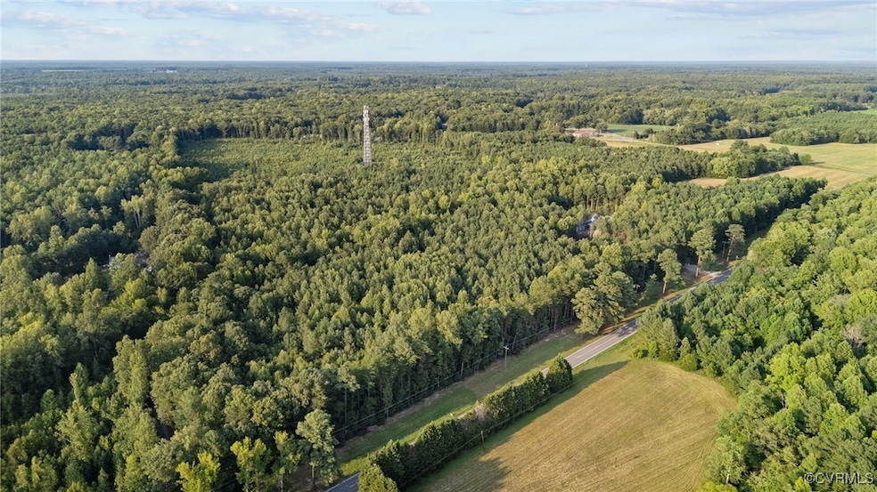 Aerial view of property and surrounding area with