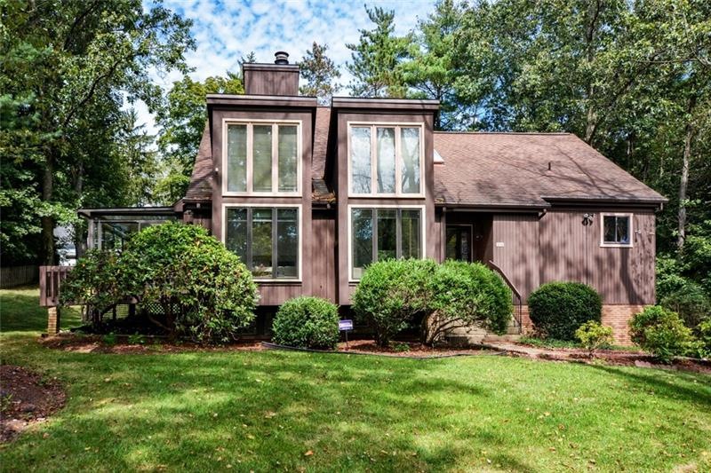 Custom-built contemporary home on large wooded lot