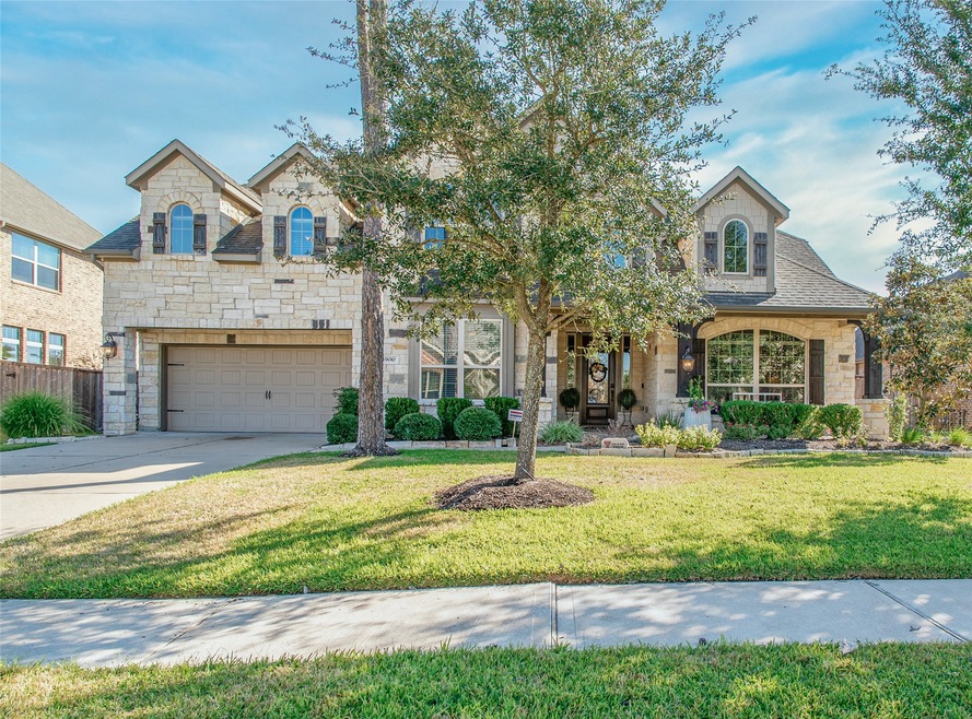 Welcome to 19010 Winding Atwood Lane located in Wildwood at Northpointe, a master-planned community in Tomball.