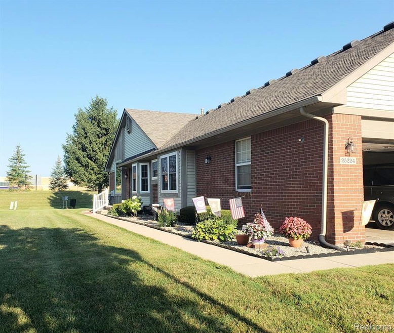 PRIVATE END UNIT ENTRANCE WITH BEAUTIFUL SIDE YARD