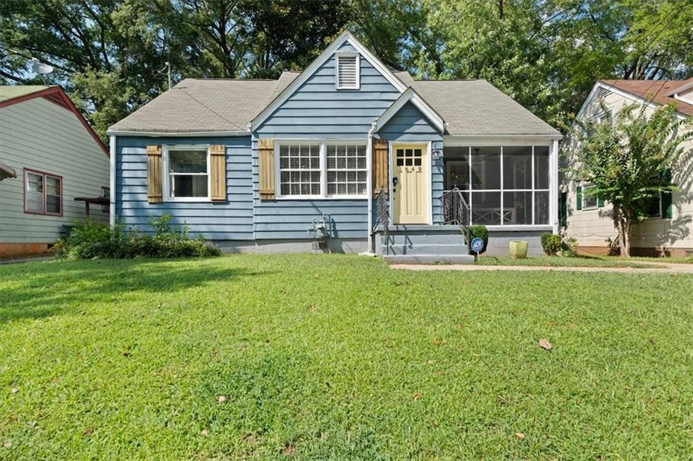 View of front of house featuring a screened porch