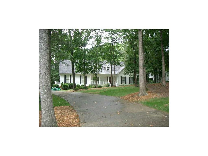 Exterior Front. Beautiful home on huge wooded cul 