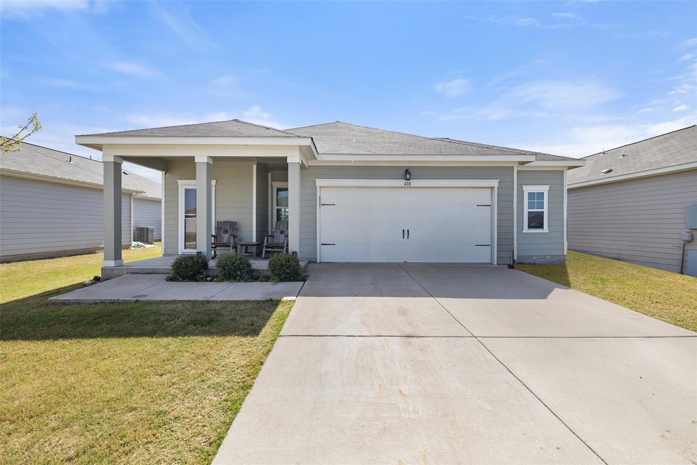 View of front of house featuring concrete drivewa