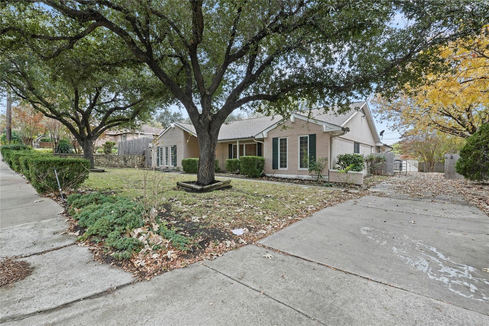 Ranch-style home featuring a front lawn