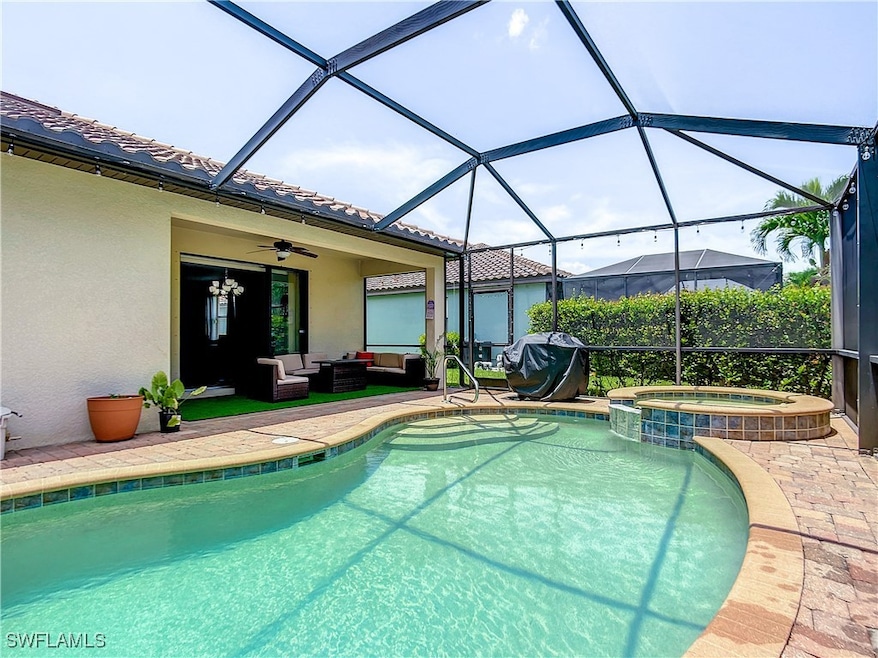 View of swimming pool with ceiling fan, a pool wit