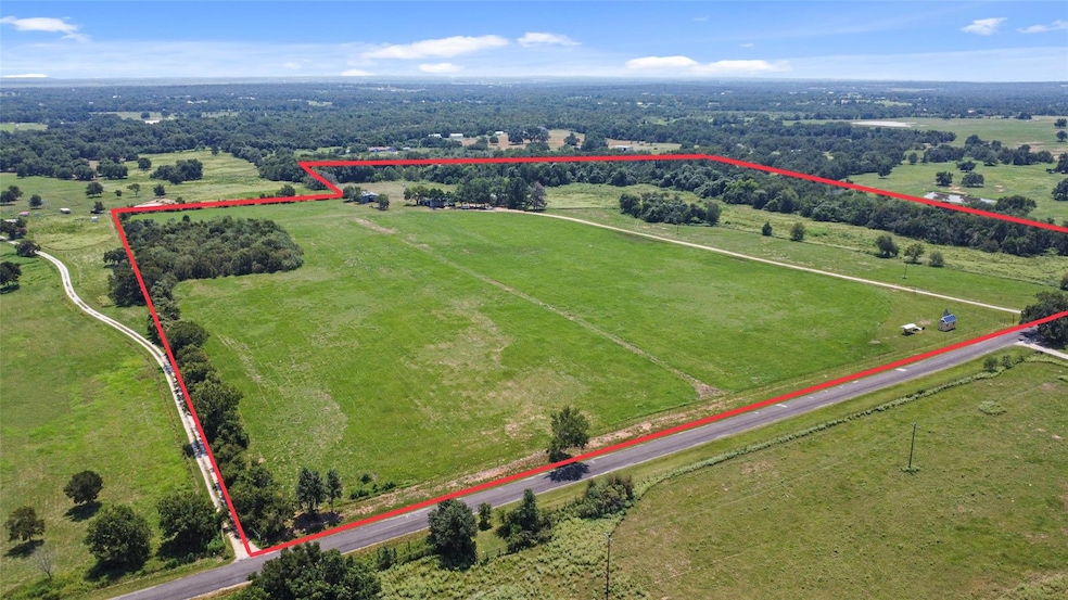 Birds eye view of property with a rural view