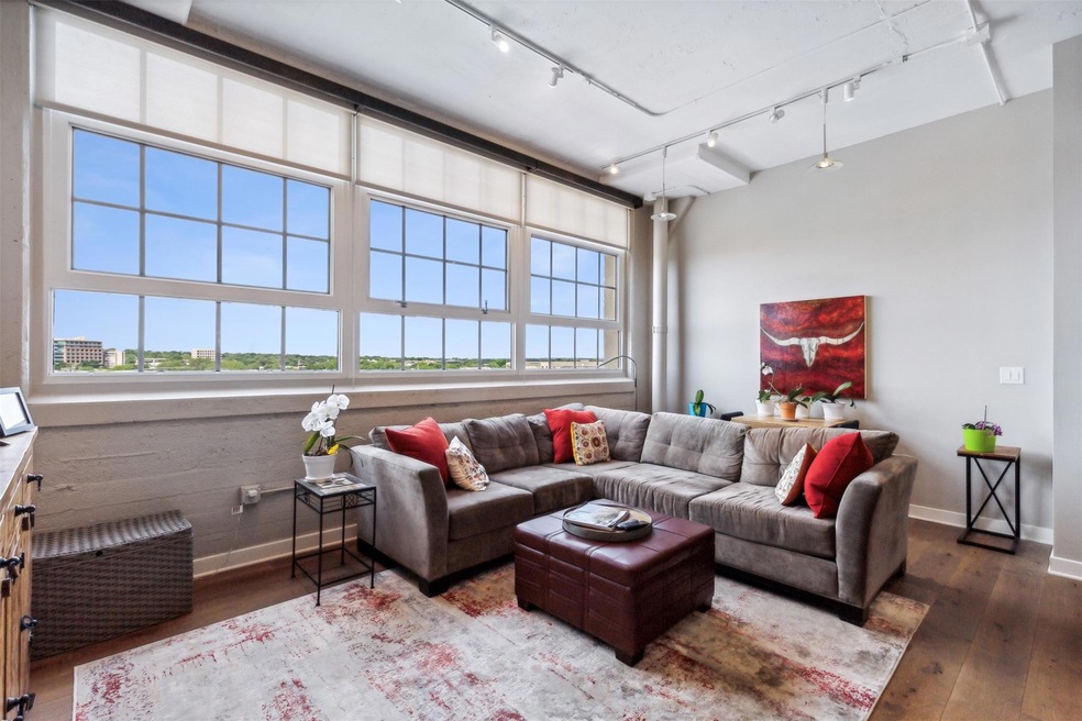 Living room featuring wide plank hardwood/wood-typ