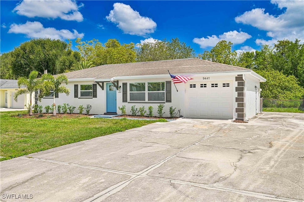 Ranch-style home featuring stucco siding, a garage