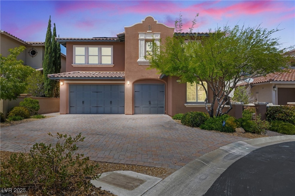 Mediterranean / spanish home with a garage, stucco