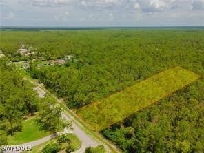Birds eye view of property featuring a rural view