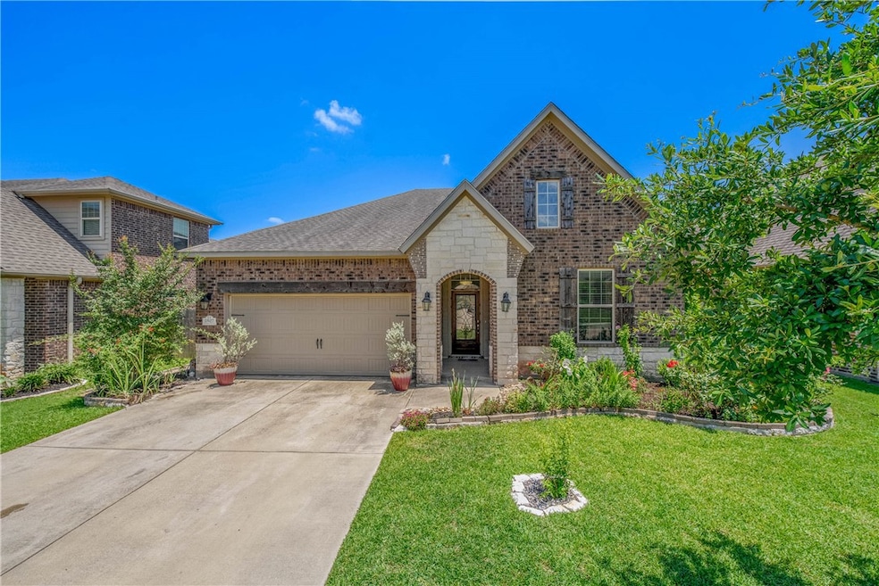View of front of house featuring brick siding, con