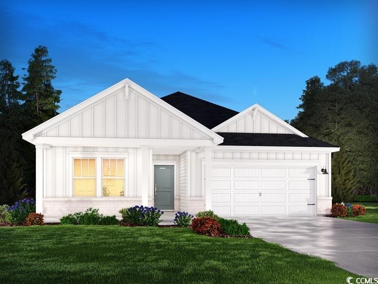 Modern farmhouse style home featuring a front lawn
