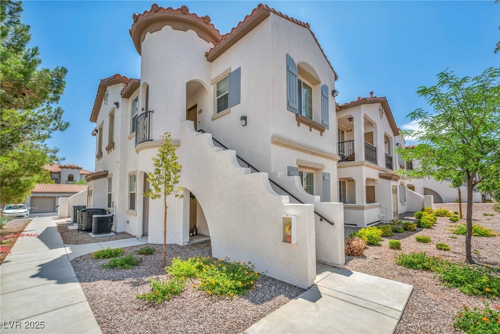 View of front of house with a tile roof, stucco si