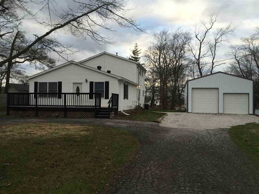 Front view of the home and barn