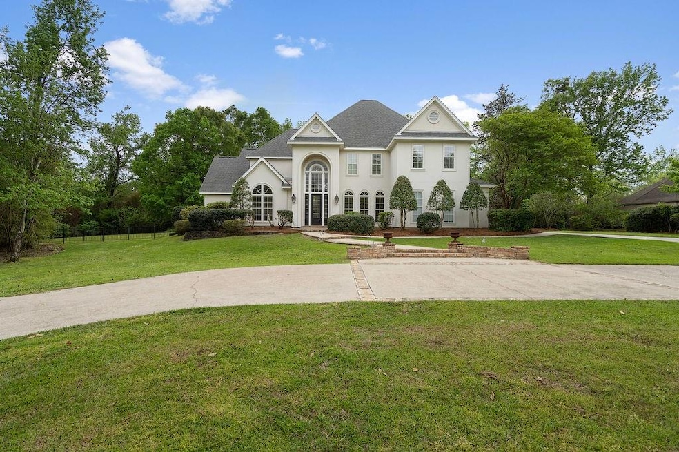 Stately home in gated Maple Ridge with lovely land